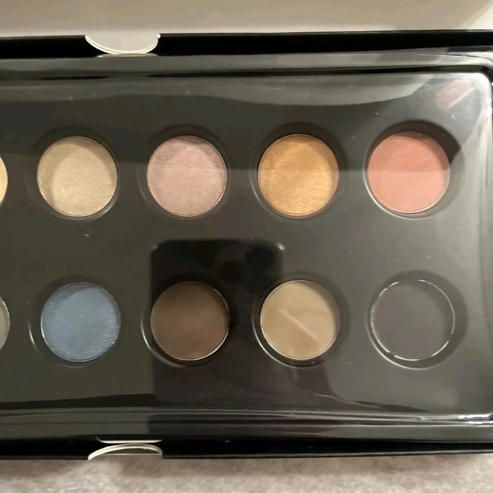 OFRA Eyeshadow Palette with Green, Blue, and Gold Hues
